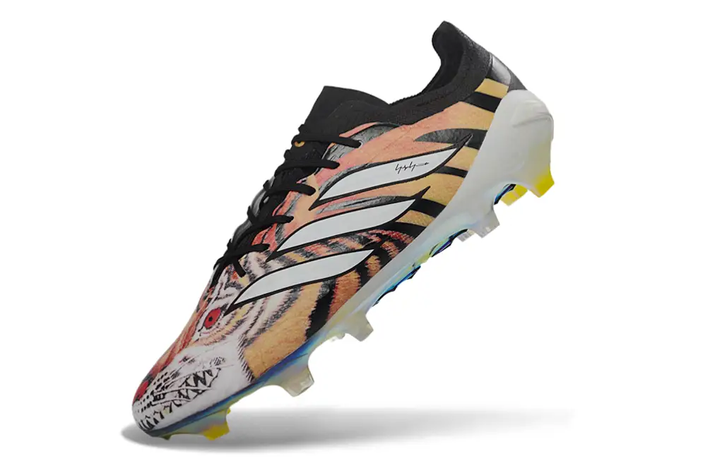 Close-up of Adidas Predator 26 Elite FG Y-3 football cleats with studs