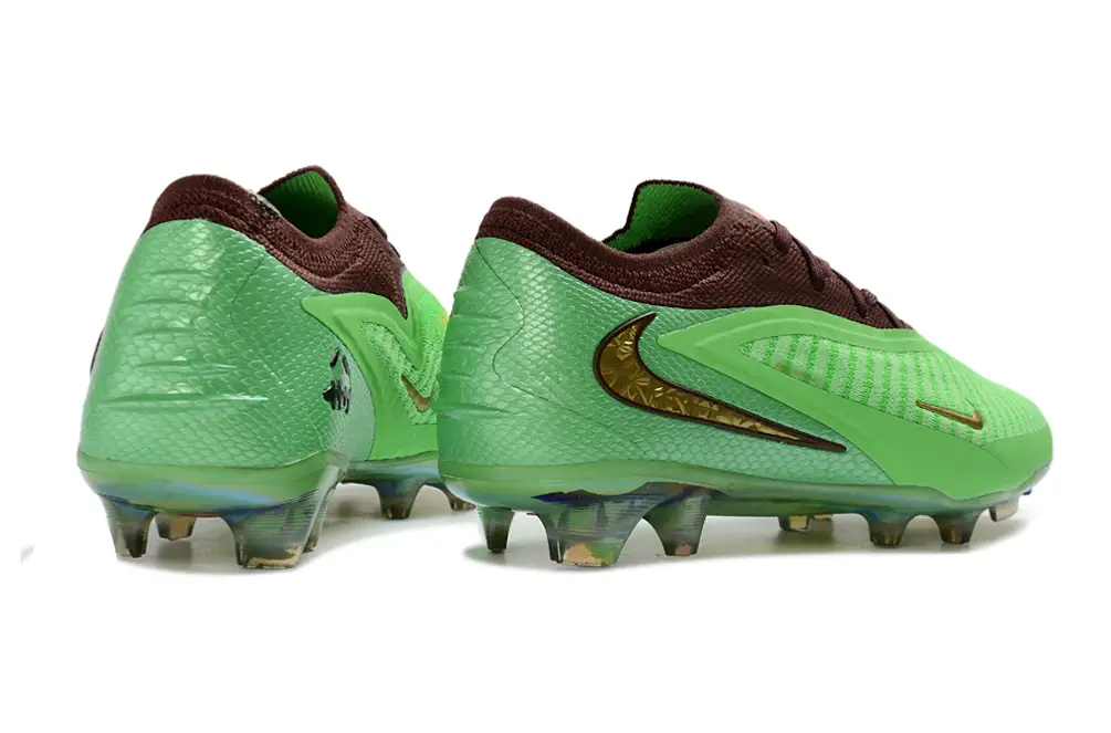 Nike Phantom 6 Elite FG x Travis Scott football boots worn on pitch during gameplay showing performance and speed control